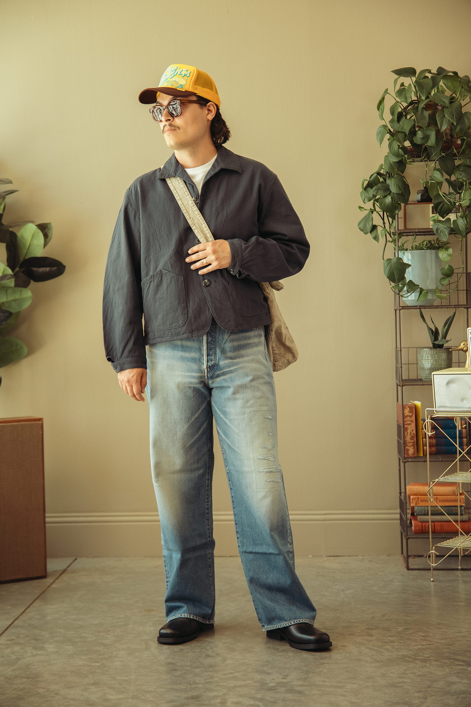 Nanamica Chino Cap in Black, Kapital BORO ZIP UP Blouson (VIRGIN MARY) in Indigo, FrizmWORKS Heavy Canvas Shoulder Bag in Black, Camiel Fortgens Pullup Hoodie in Navy, Nanamica Cargo Pants in Olive Drab, and Salomon Advanced XT-Whisper in White/Lunar Rock/Ftw Silver.