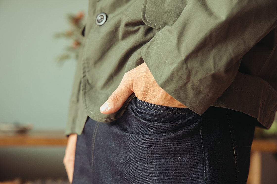 Image of model wearing Conkers Rambler Blazer in Seafoam with hand in pocket closeup