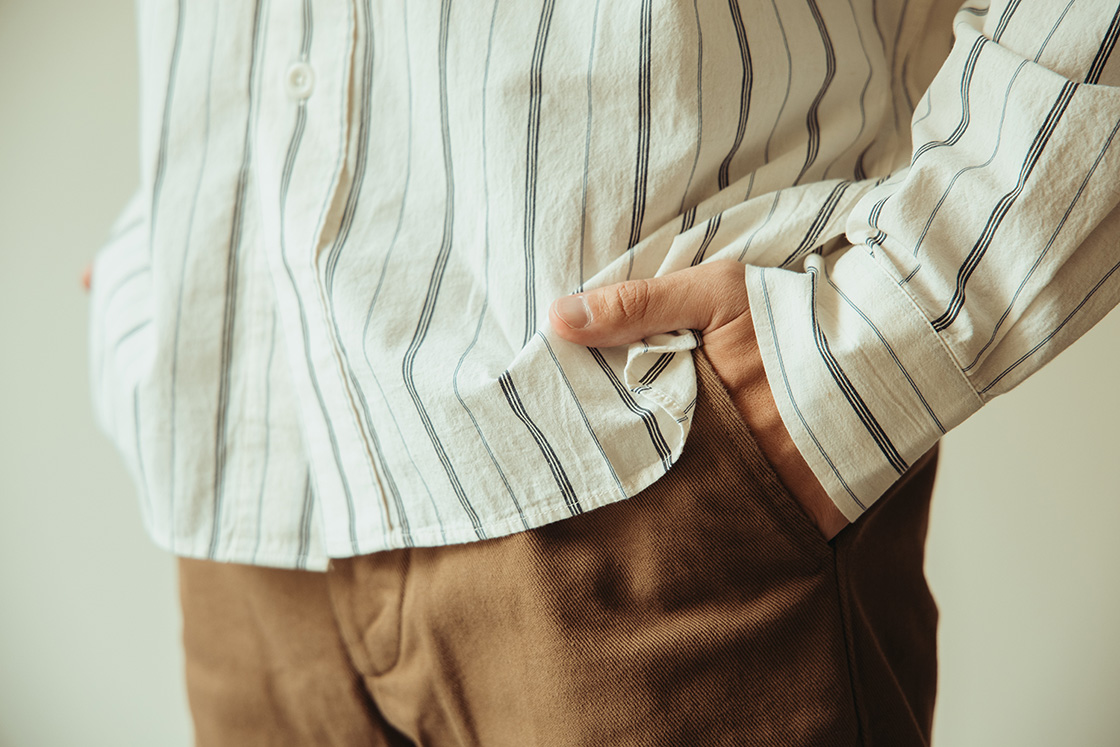 Detail Shot of a Margaret Howell Styled Look Featuring the Striped Collared Shirt and Pants