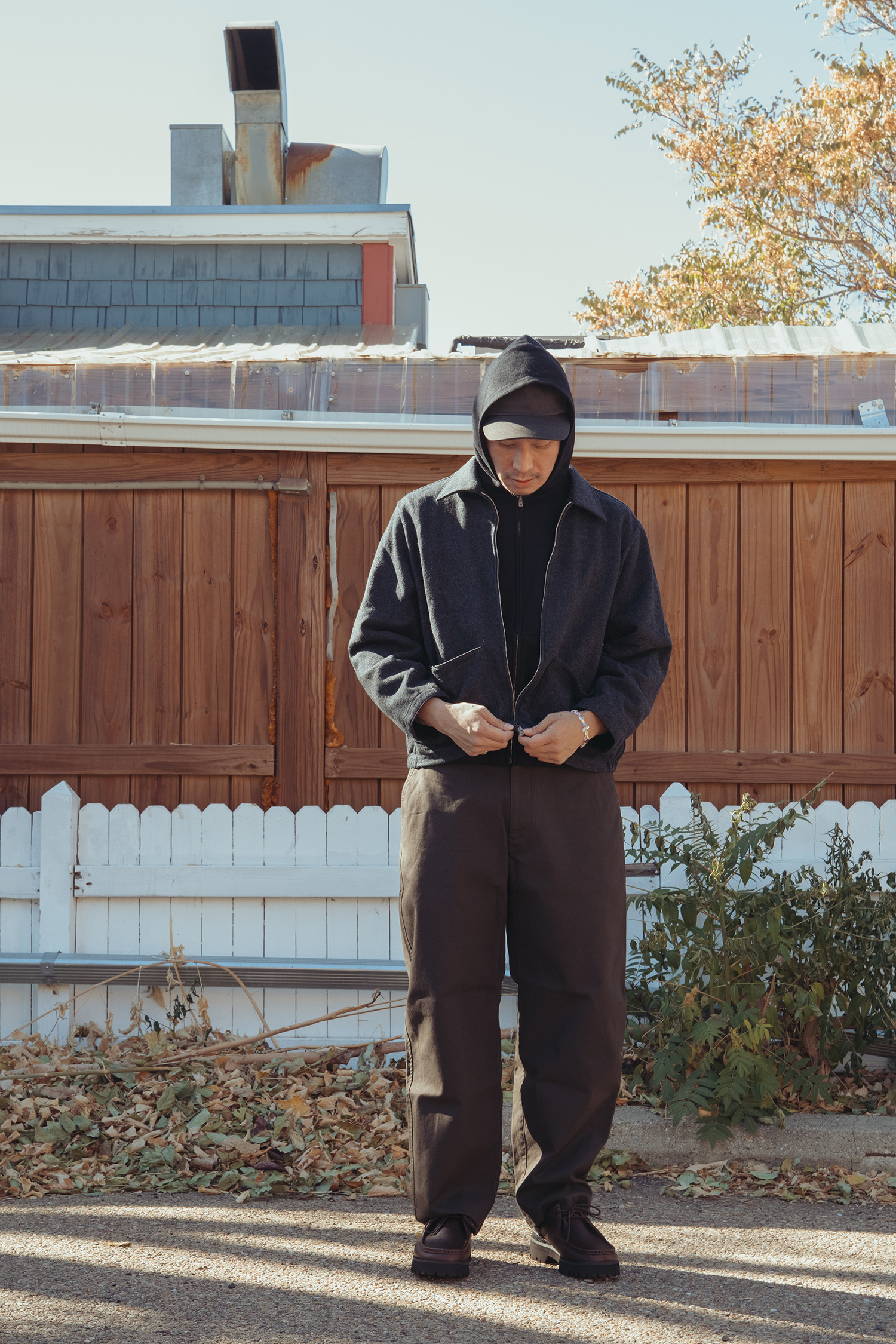 Our Legacy Evening Polo in Smokey Brown Fuzzy Alpaca, Ordinary Fits Ordinary French in Black, Kapital 13oz Denim T-back Book Bag, and Hender Scheme Concave in Black.