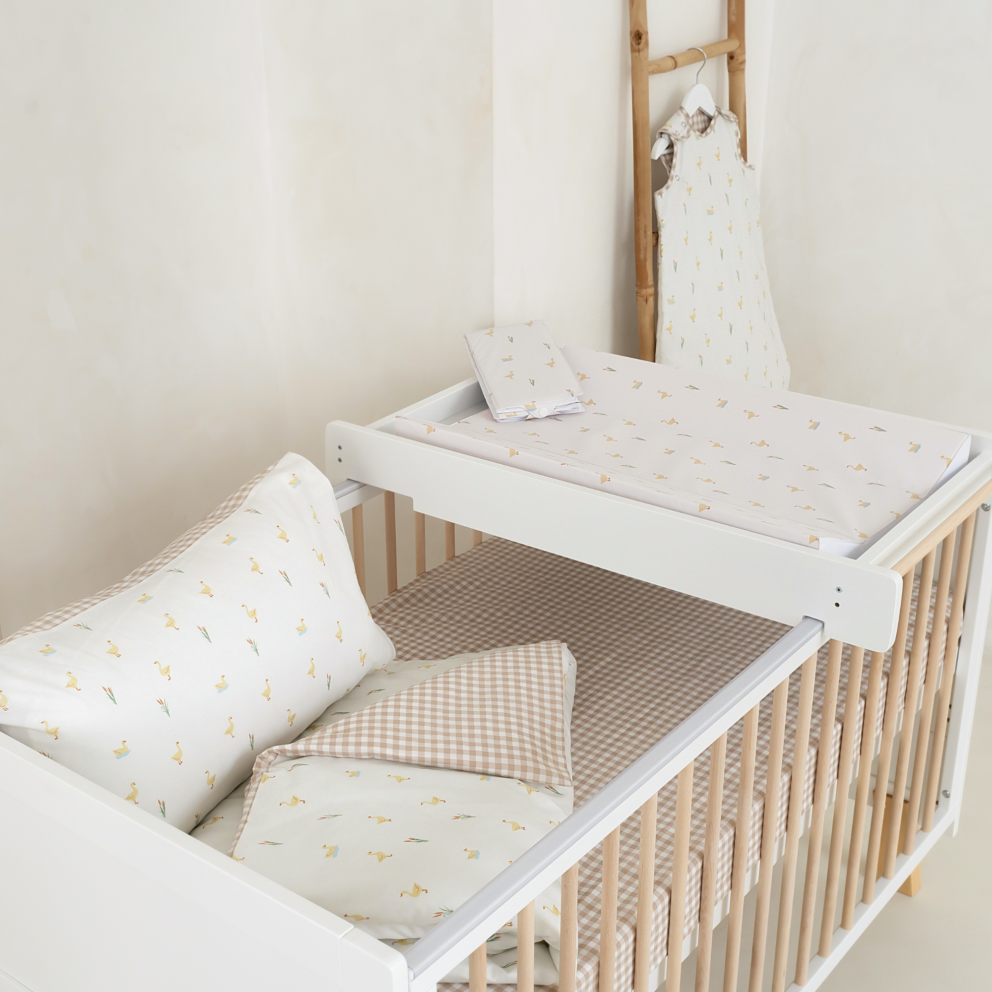 Full Little Duckling Collection laid out in the Essentials Cot Bed