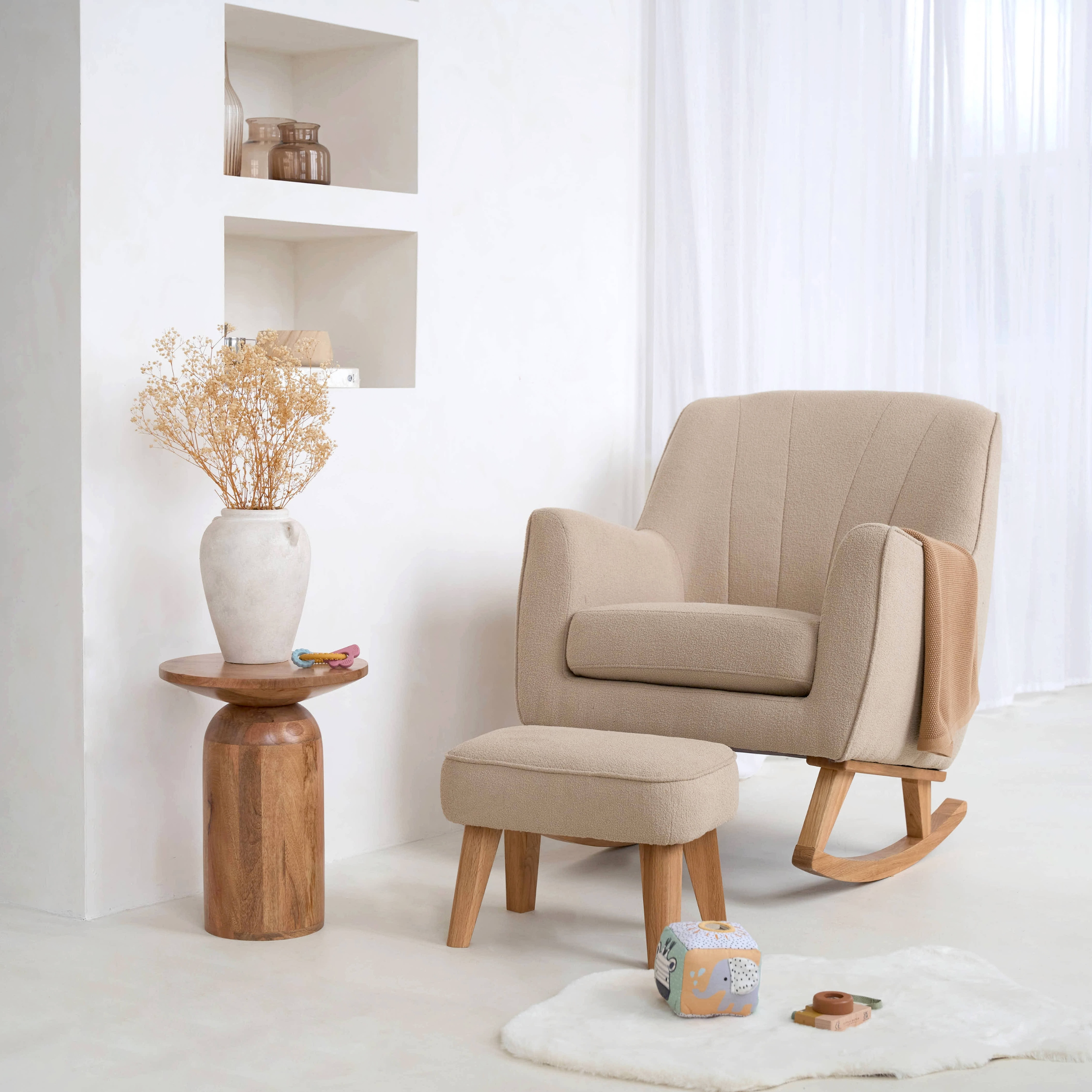 Clair de Lune Bouclé Rocking Chair & Footstool in a white minimalist nursery