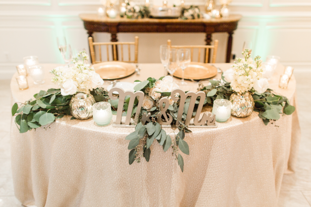 Indoor wedding reception round sweetheart table