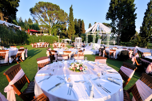 Outdoor wedding reception with round tables