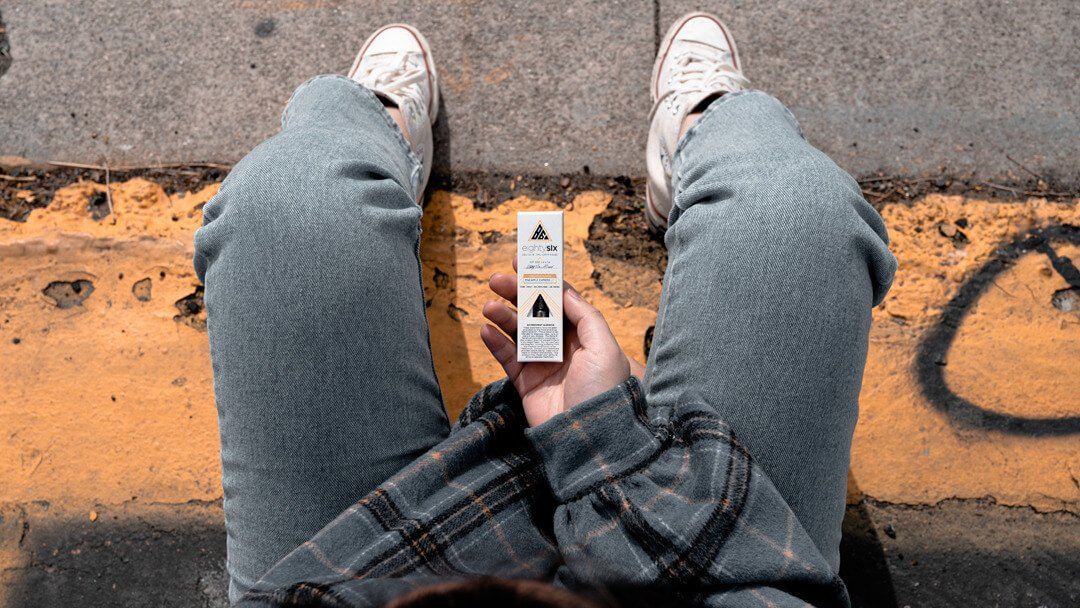Person holding a Delta-8 vape cartridge