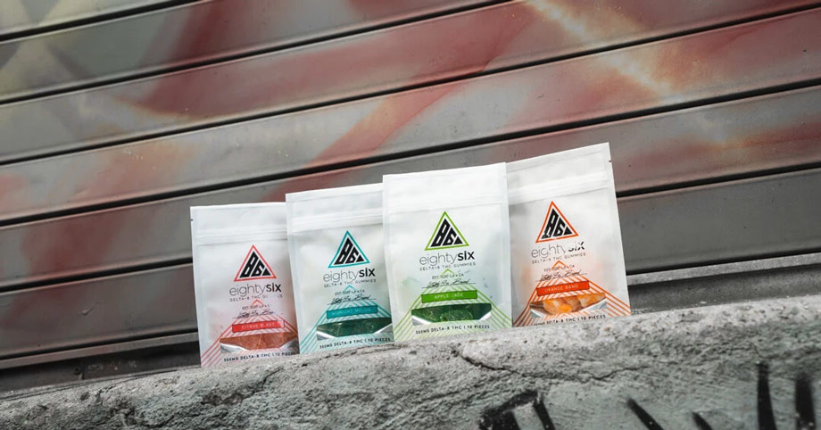 Line up of Delta-8 gummies in front of a wall