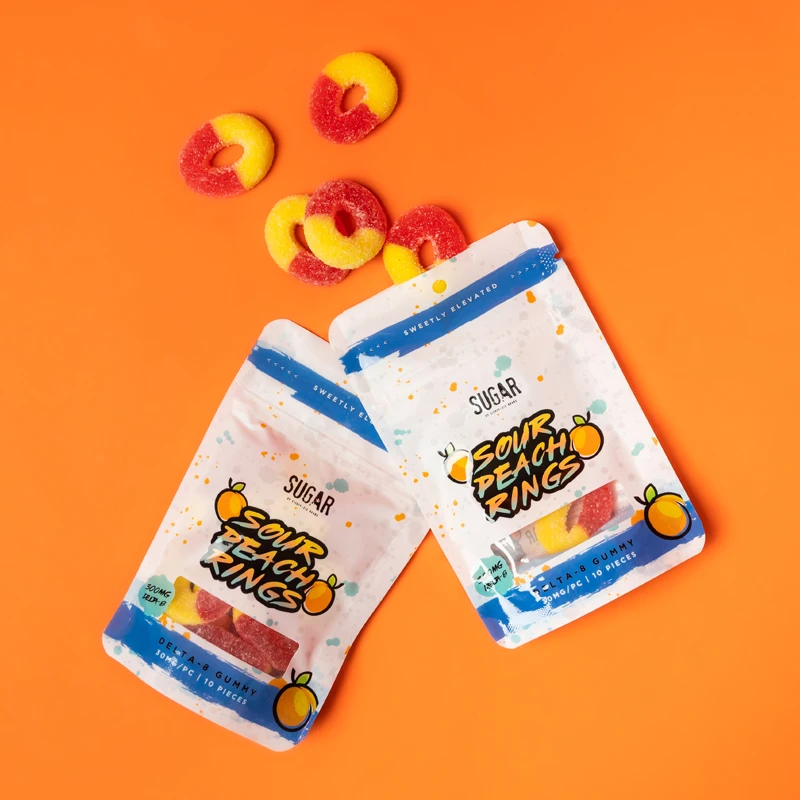 Delta-8 Sour Peach Rings on an orange background