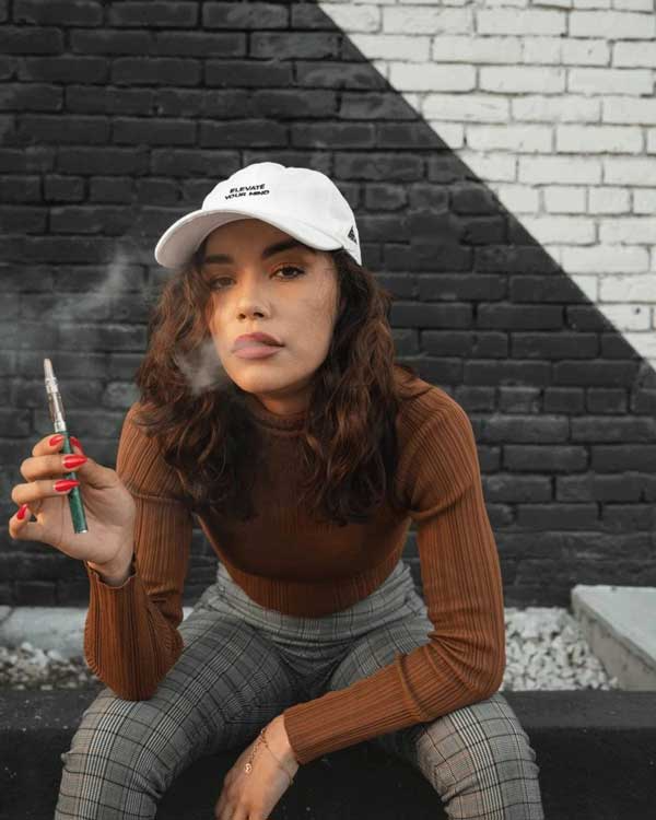a woman with a vape pen