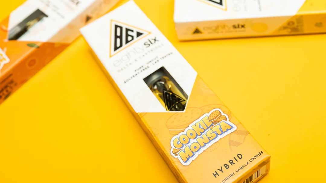 Cookie Monsta Delta-8 cartridge on a yellow background