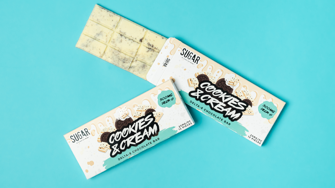 Cookies & Cream Delta-8 chocolate bar on a blue background