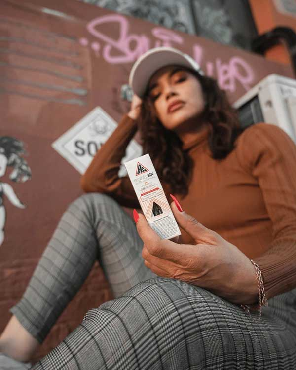 a girl with a Delta-8 cartridge