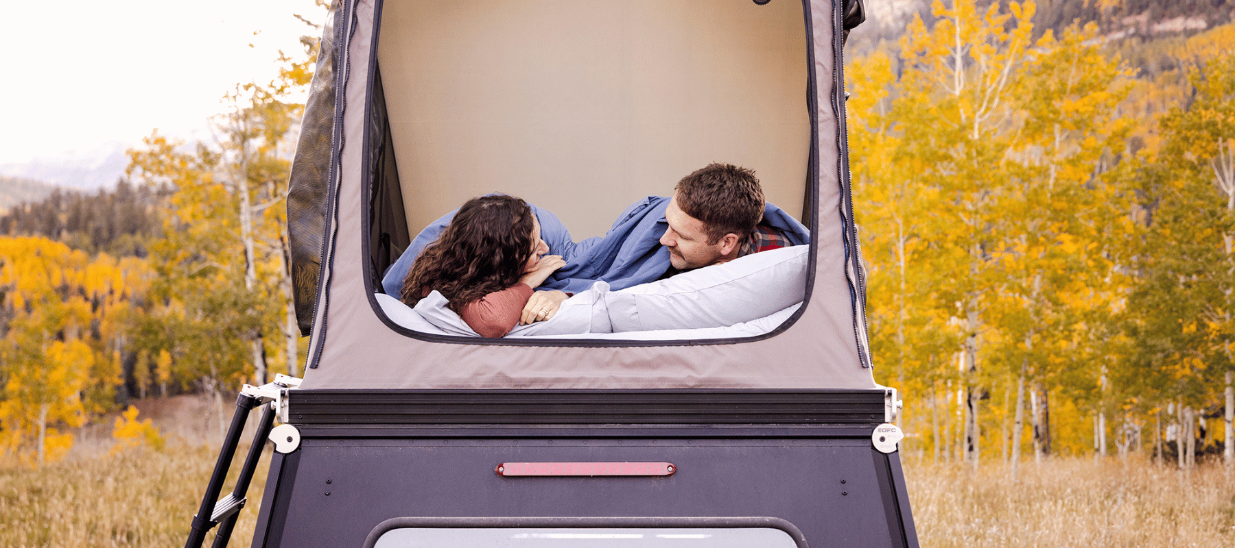 Two HEST Foamy mattresses linked side by side in rooftop tent for couple sleeping