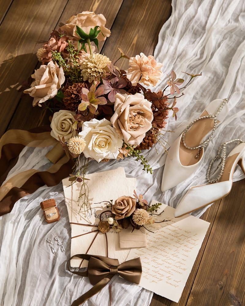 The tablescape began with a creamy silk base cloth, its sheen catching the light like morning dew. Over it, we layered airy blush or ivory sheers, cascading down the edges to create movement. Our design tip: when mixing heavy and light fabrics, always let the lighter fabric drape freely. This contrast between structure and softness instantly elevates a table.