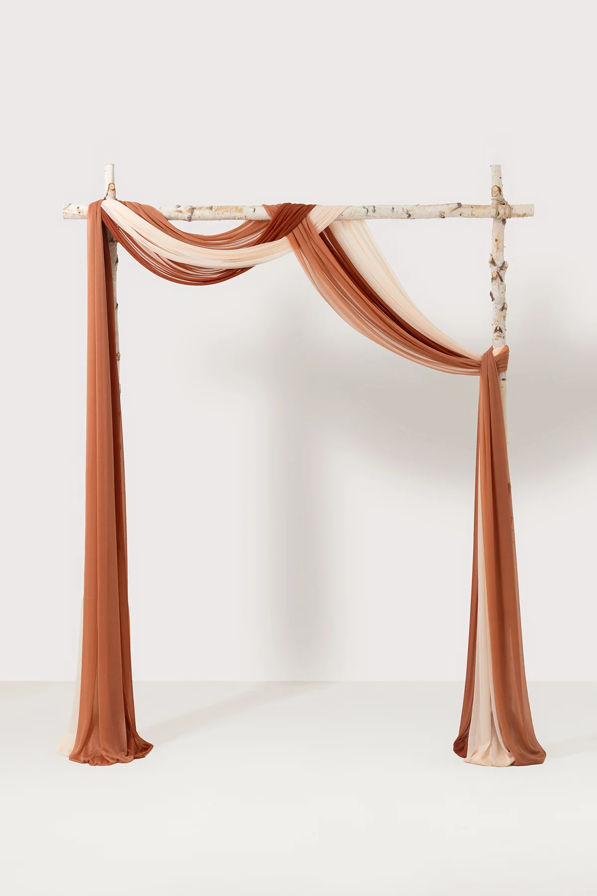 Arch Drapes Set in Warm Sunset Terracotta