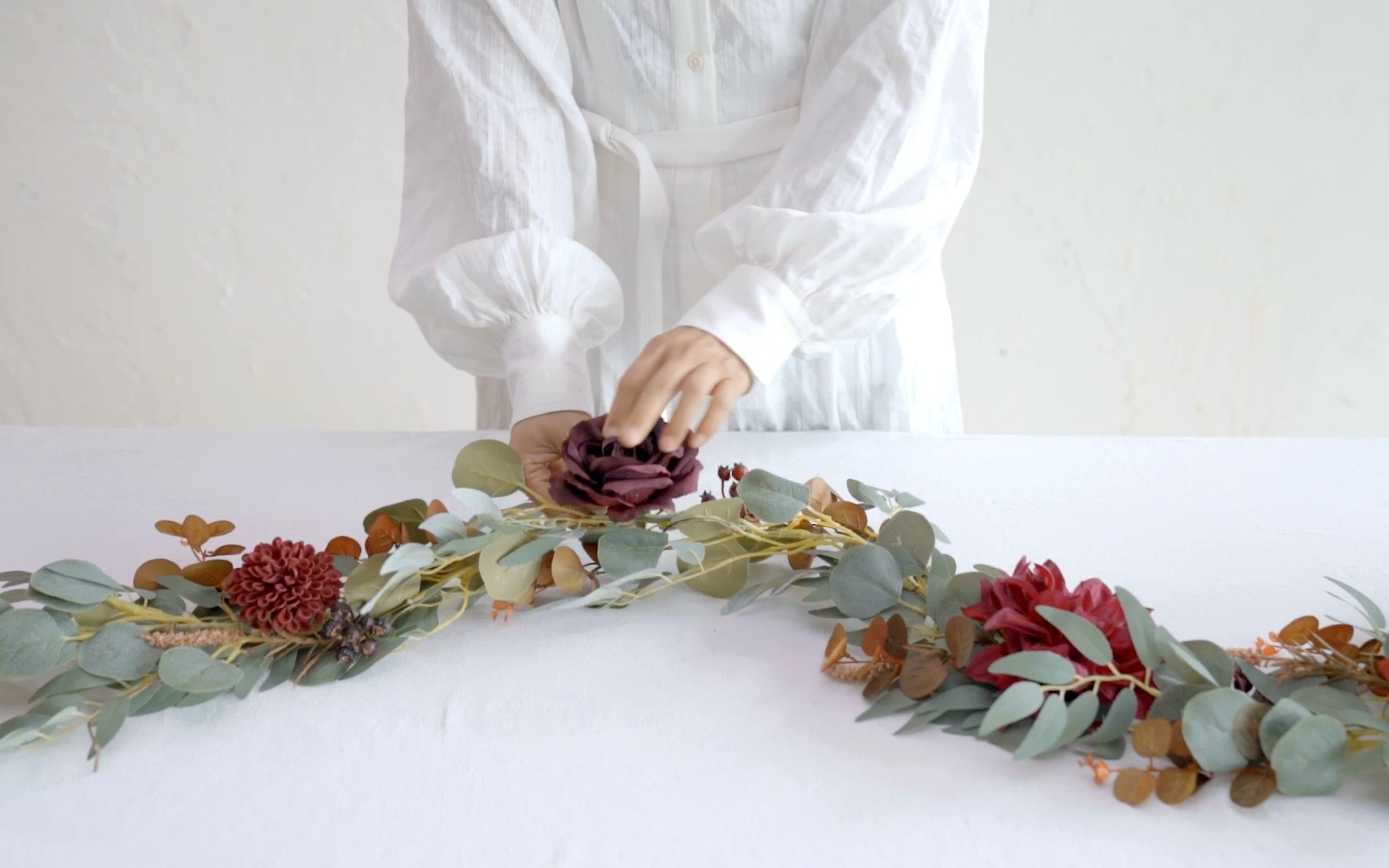 6ft Eucalyptus and Willow Leaf Garland with Filler Flowers in Sunset Terracotta