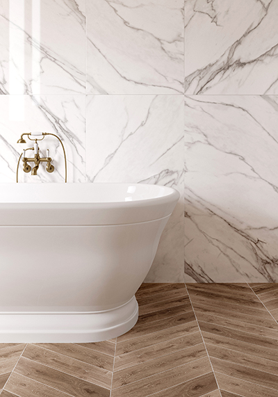 Modern bathroom tile inspiration showing Adastra Statuario marble effect tiles with subtle grey veining, used on walls for a light, elegant bathroom scheme.