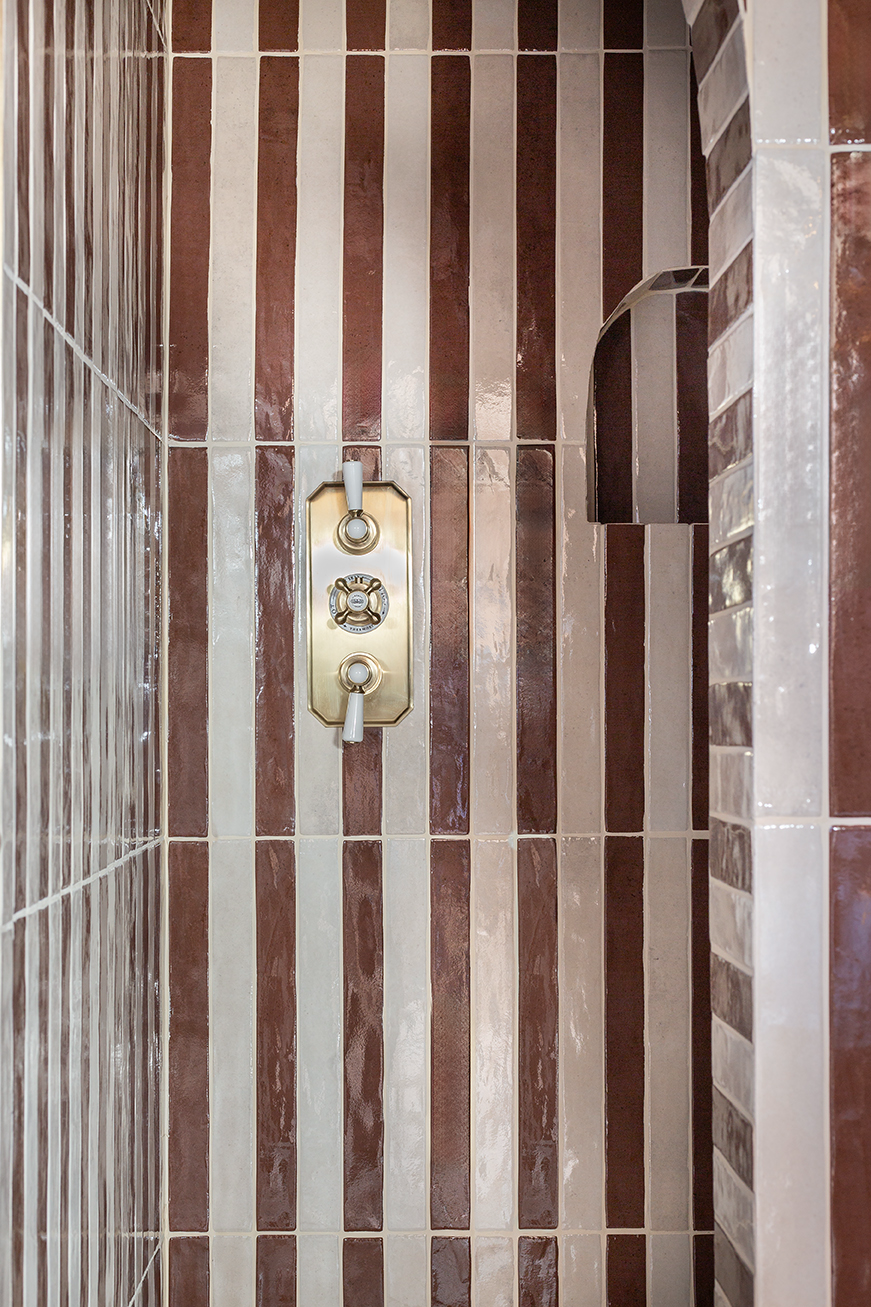 Modern bathroom tile inspiration with striped layout using elongated Luella Claret Red