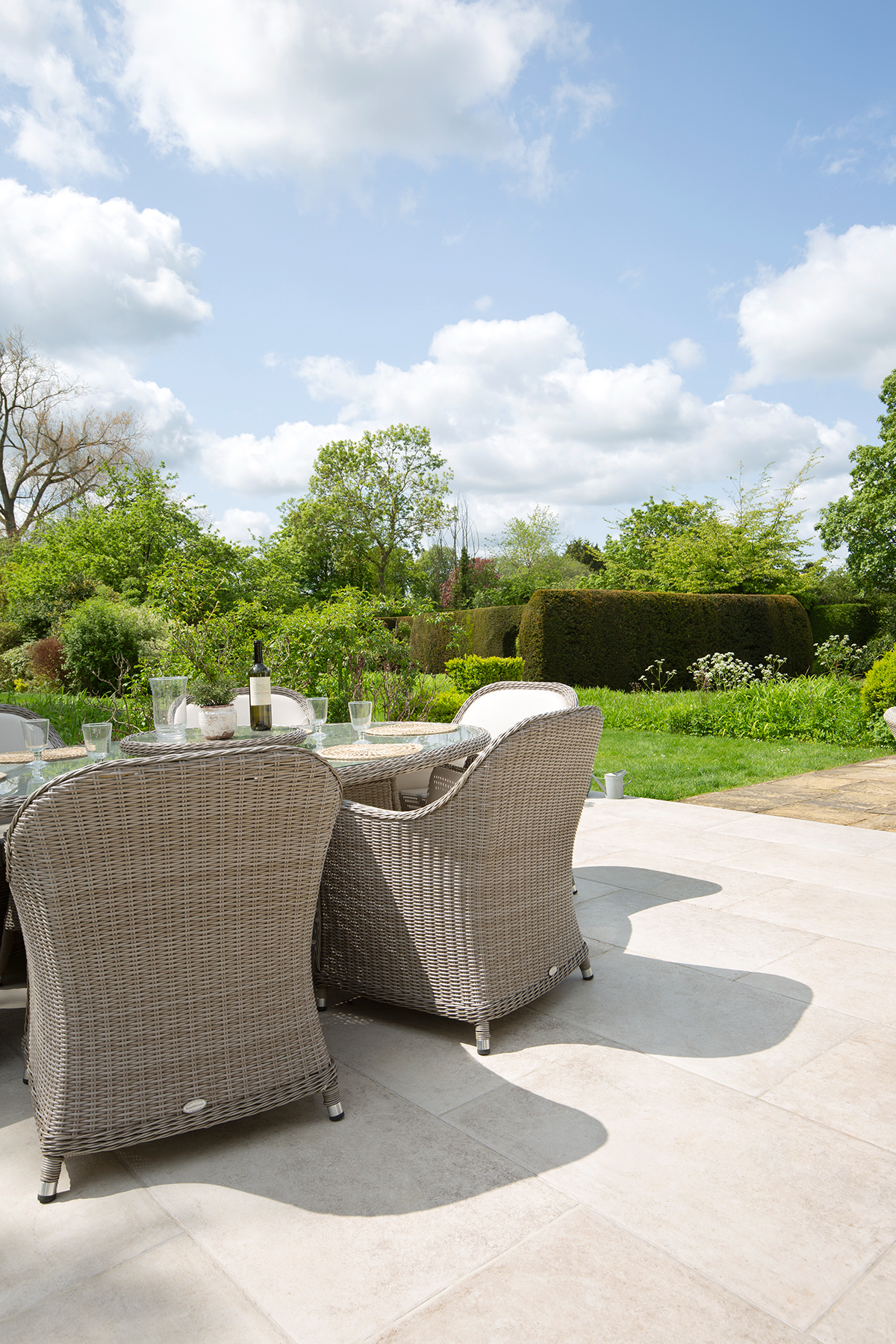 Patio with Provence Crema pavers with outdoor chairs and table