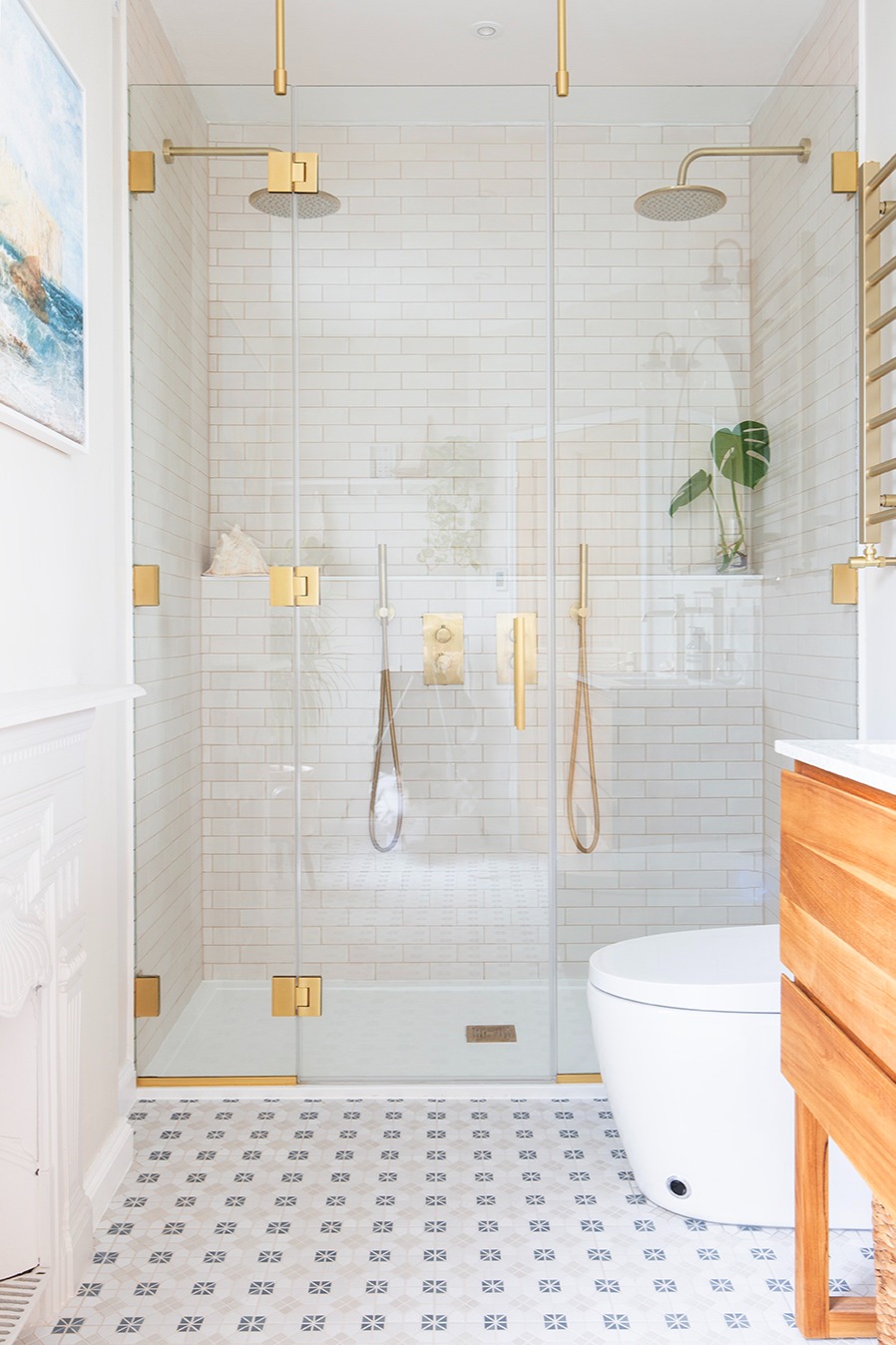 Modern bathroom tile inspiration with patterned floor tiles using Regent Blue decorative tiles, adding colour and character to contemporary bathroom floors.
