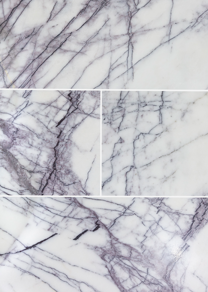 close up of carrara viola honed marble tiles with grey and purple veining