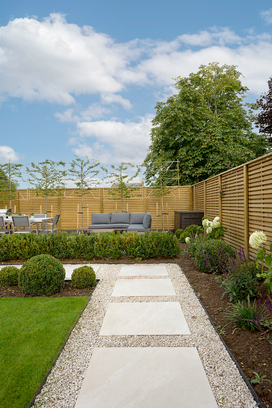 Stone effect porcelain patio with gravel in-between each tile