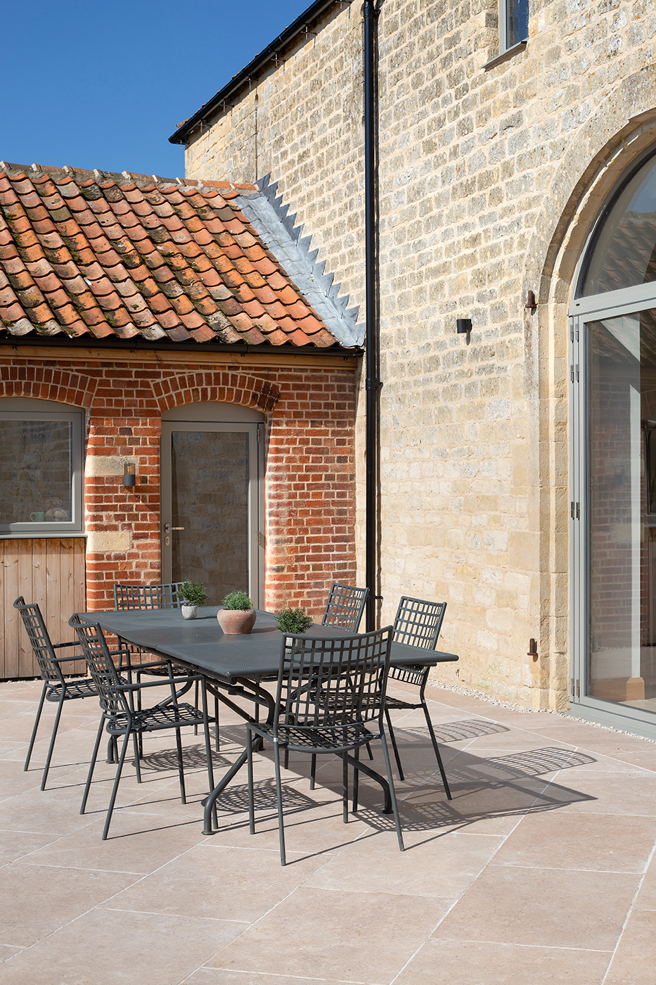 Patio with Dijon Beige porcelain and garden seating