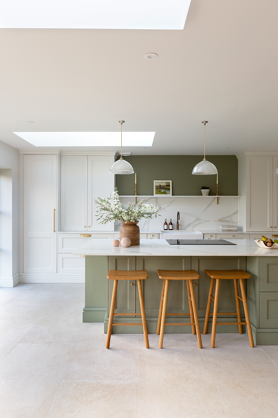 Orwell Natural Porcelain flooring with a green island and white counter tops 