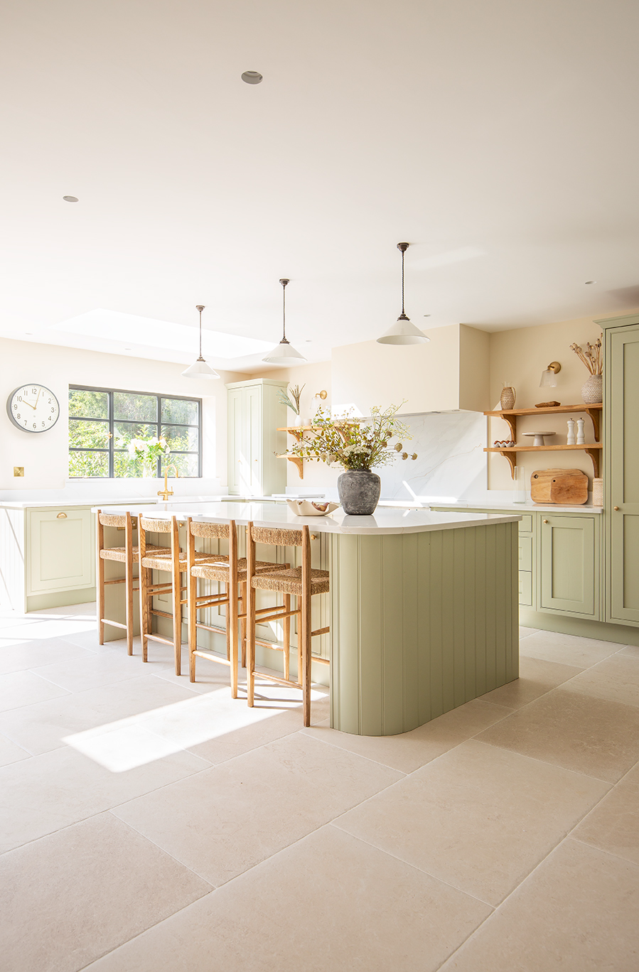Dorchester Aged White tiles in a bright kitchen with light green cabinetry 