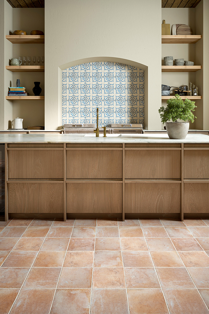 rustic wooden kitchen with terracotta floor tiles