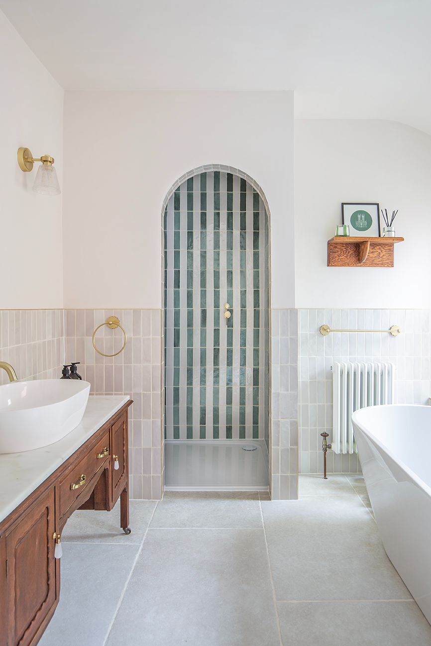 light and airy bathroom with green and white striped tiles