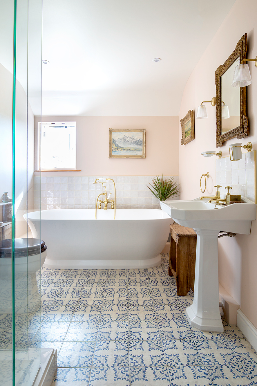 blue and white patterned floor tiles in bathroom