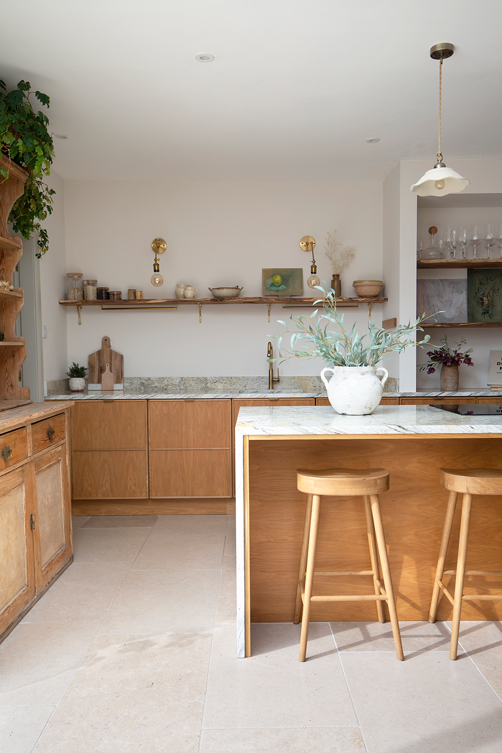 Dijon Tumbled Limestone Tile Flooring in a wooden kitchen