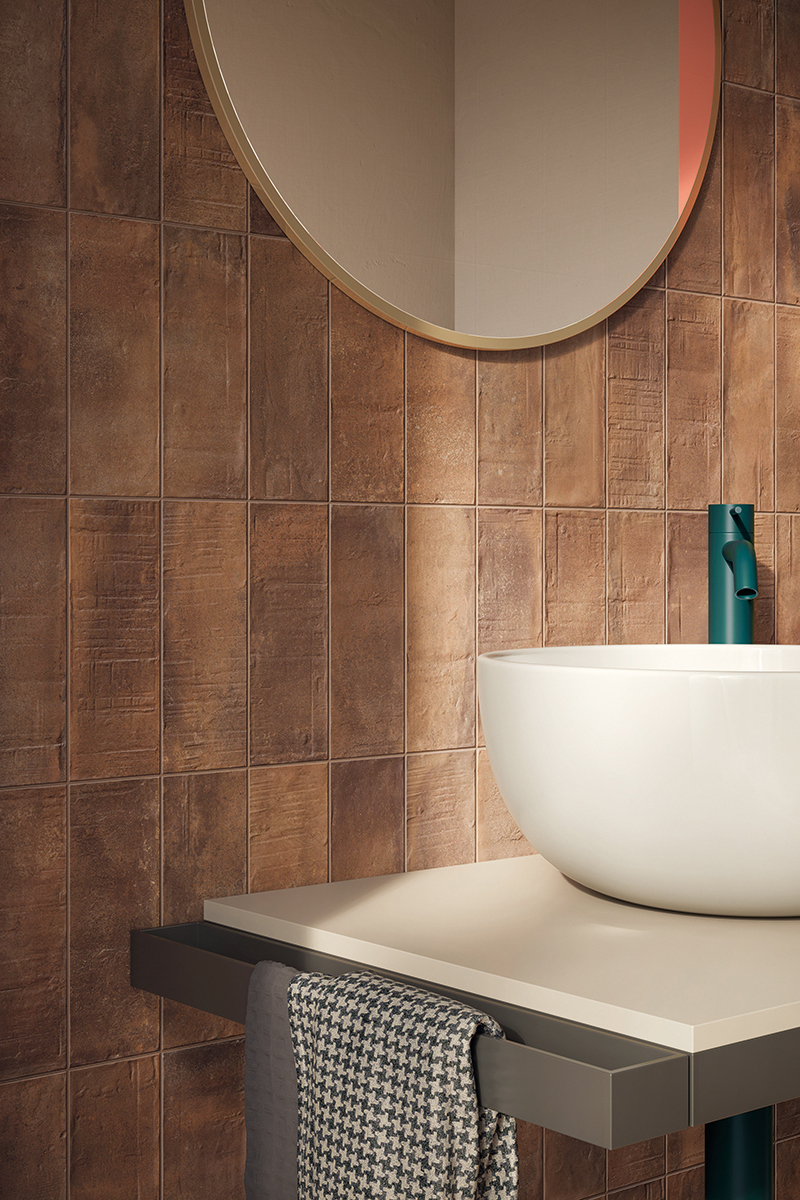 terracotta metro wall tiles with texture and vanity sink with mirror