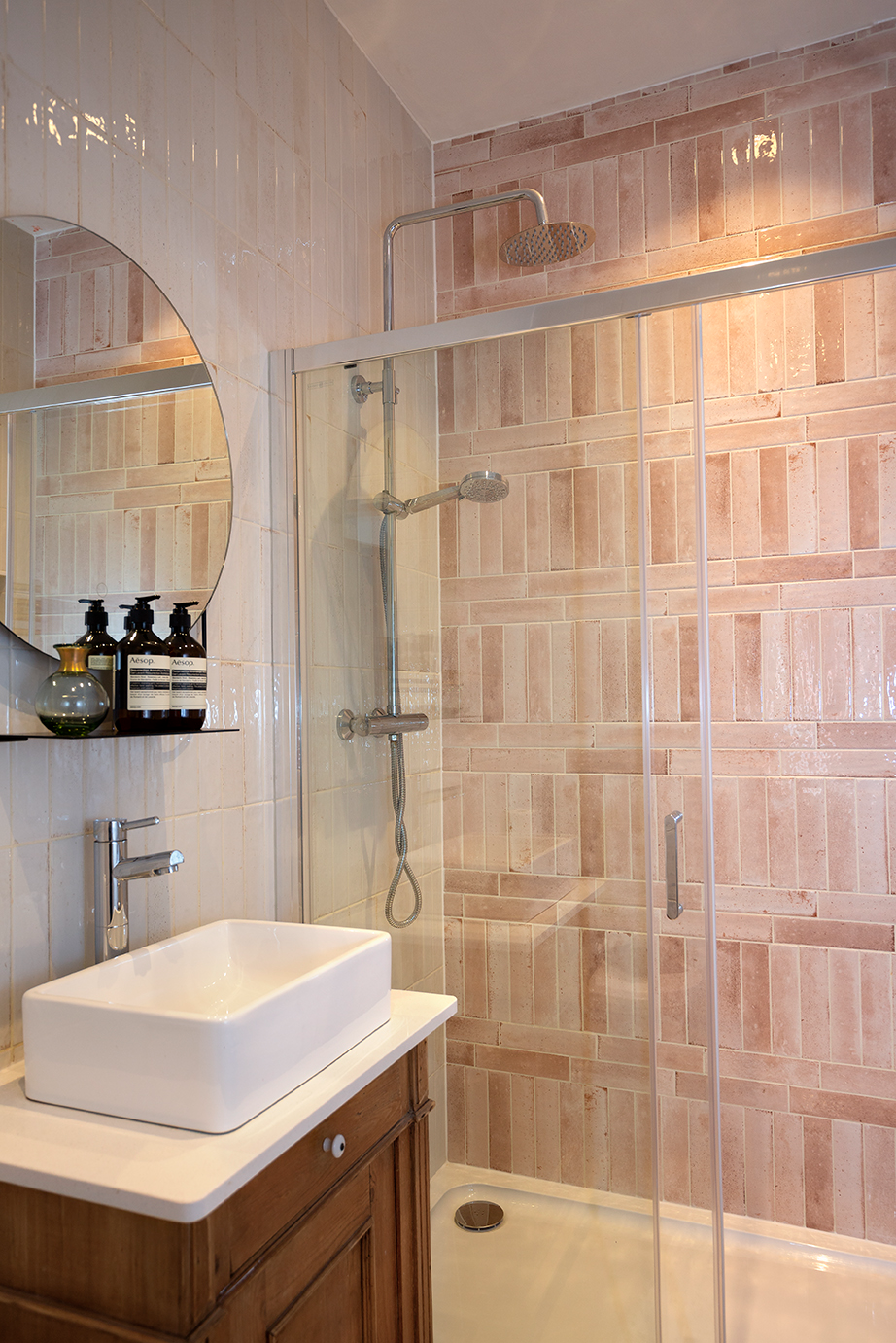 Modern bathroom tile inspiration showing Hockley Antiqued Rose metro tiles in a shower cubicle, with textured pink tones and subtle variation for a stylish, contemporary look.