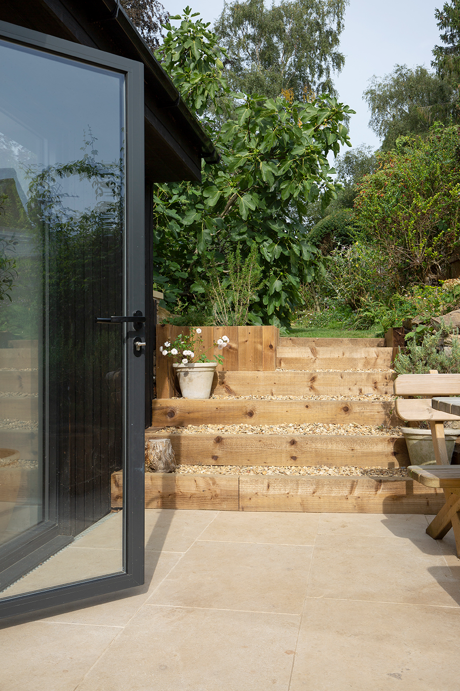 garden with a table and chairs and Tuscany Seasoned pavers