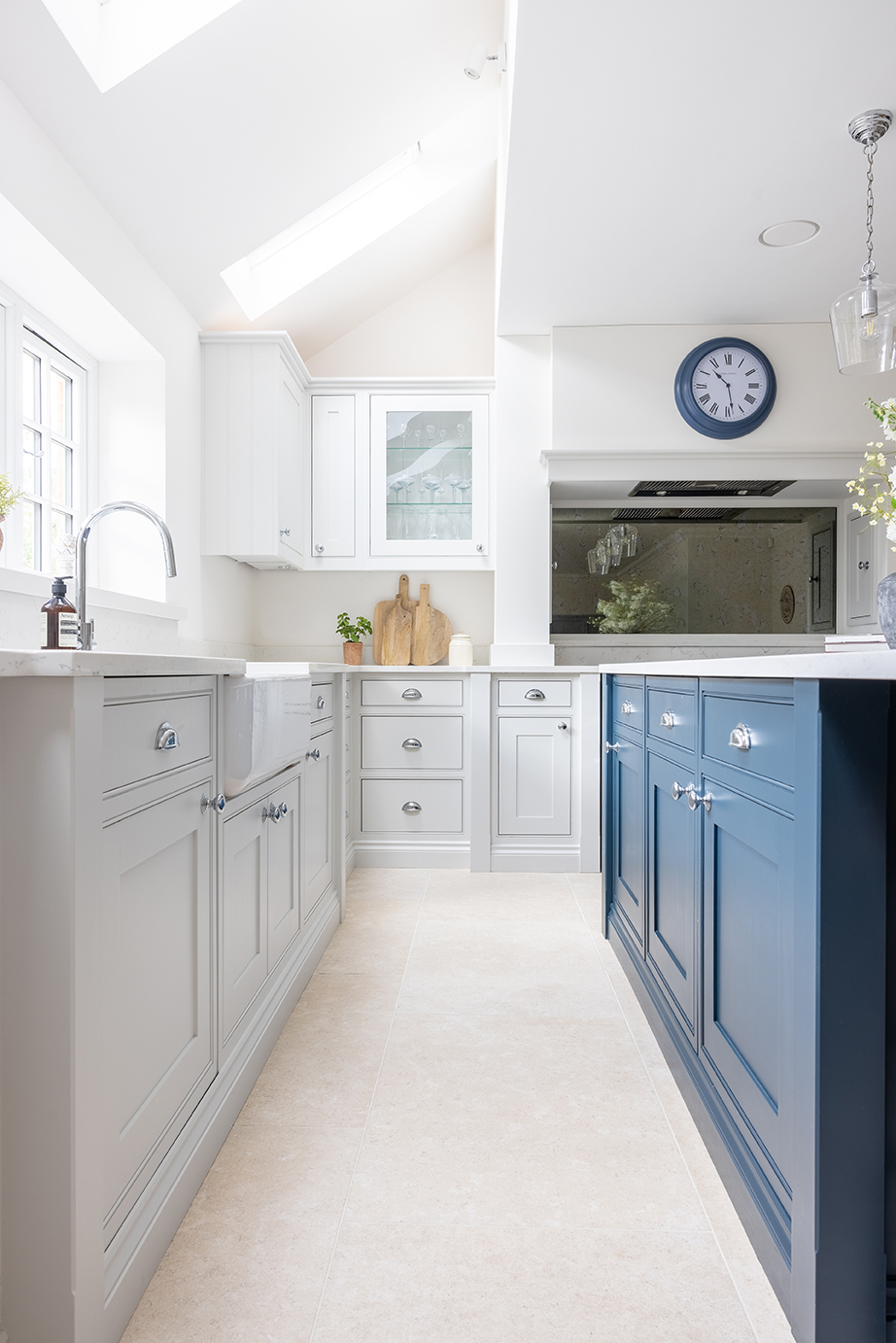 Lullington stone effect floor with navy and blue units with white counter tops 