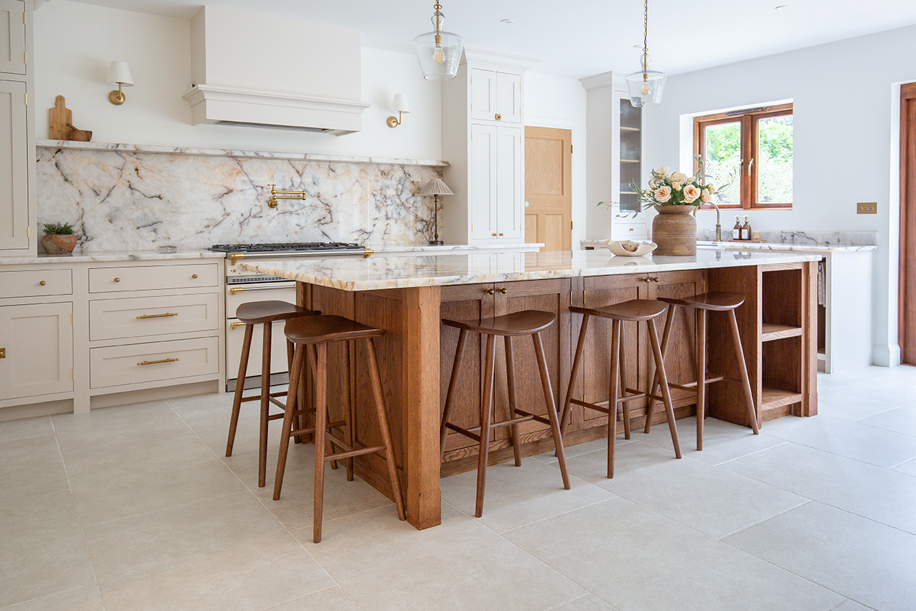 ivory stone effect porcelain floor tiles with oak kitchen island and marble worktop