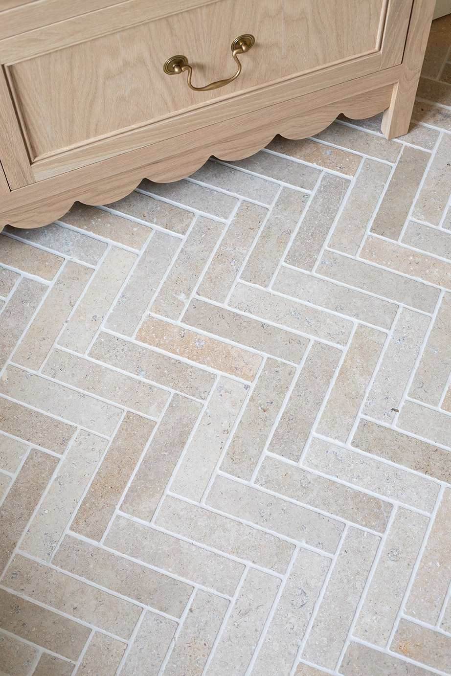 A close up of Dijon Herringbone pattern floor