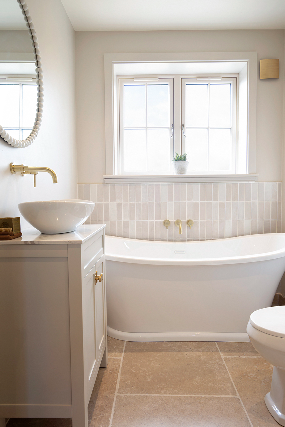 neutral bathroom with beige limestone floor tiles