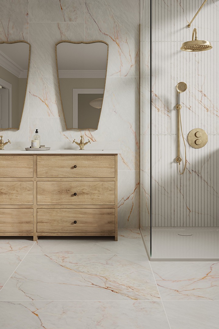 Modern bathroom tile inspiration featuring Carrara Rosa marble-effect tiles drenching walls floor-to-ceiling, adding soft pink tones and subtle veining