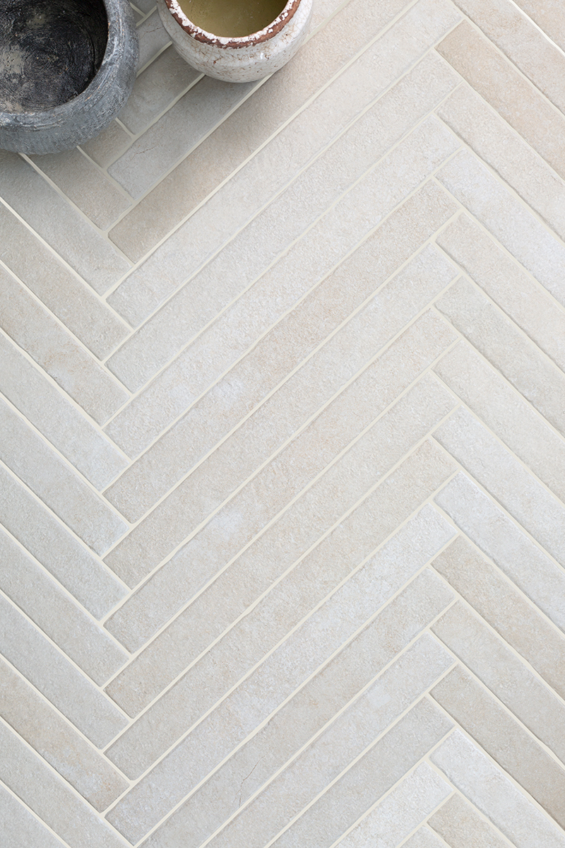 A Castello Ivory herringbone floor close up with garden pots