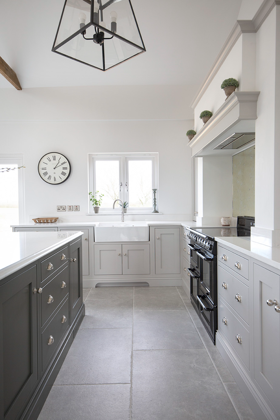 Hambleton Grey kitchen tiles with a cream cabinets and a white large sink 
