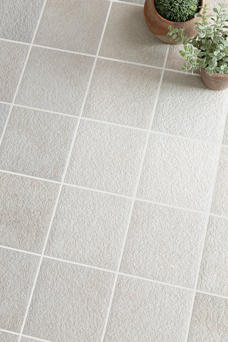 Flat lay of Clariston Natural square cobbles with plant pots