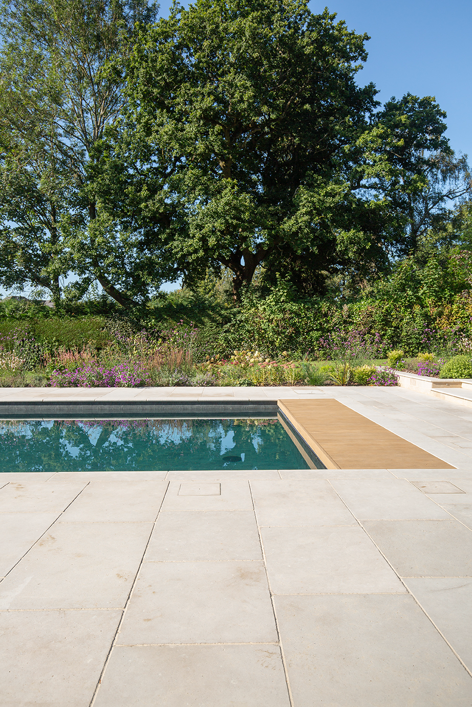 Versailles limestone surrounding a pool in a garden