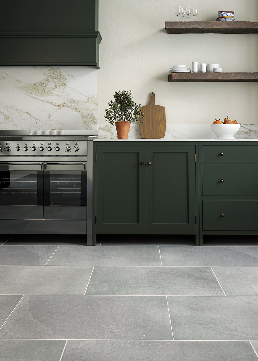 grey slate kitchen tiles with natural stone veining and dark green kitchen units