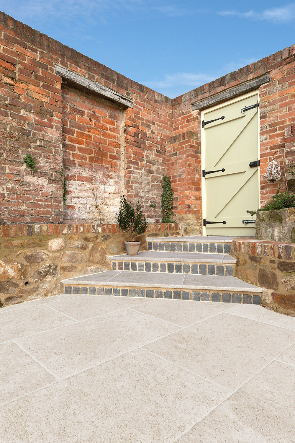 Garden Patio with Dijon Rendition Porcelain paving with steps
