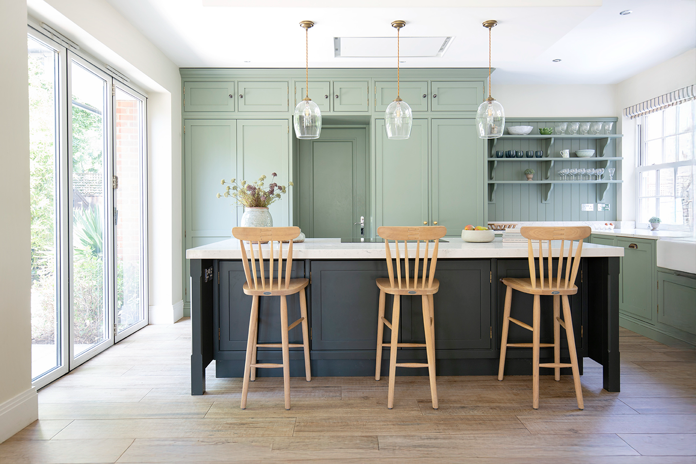 Henbury wooden oak wooden effect floor tiles with a dark island with wooden stalls