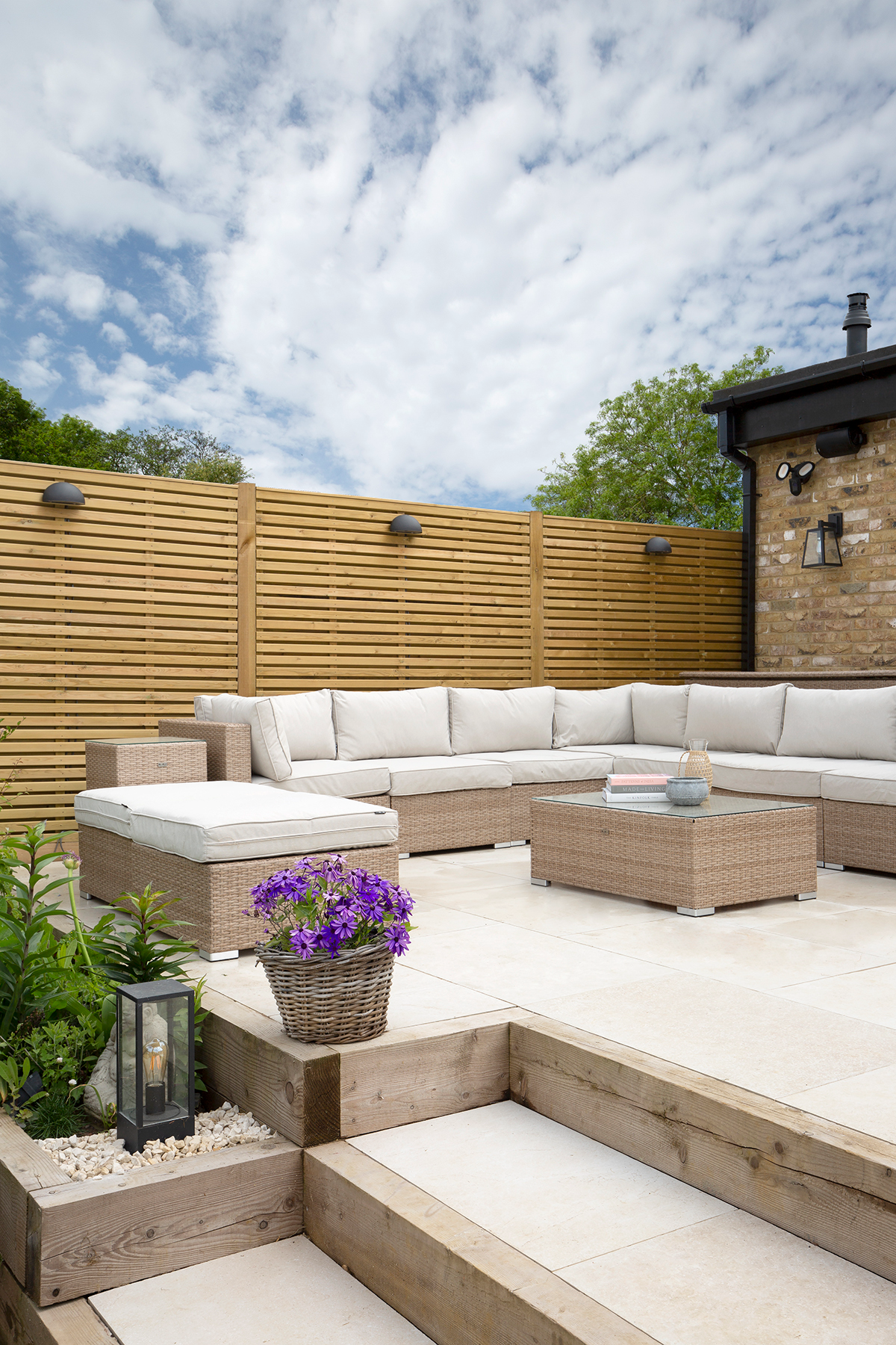 Dorchester Aged White patio with a corner sofa and a table