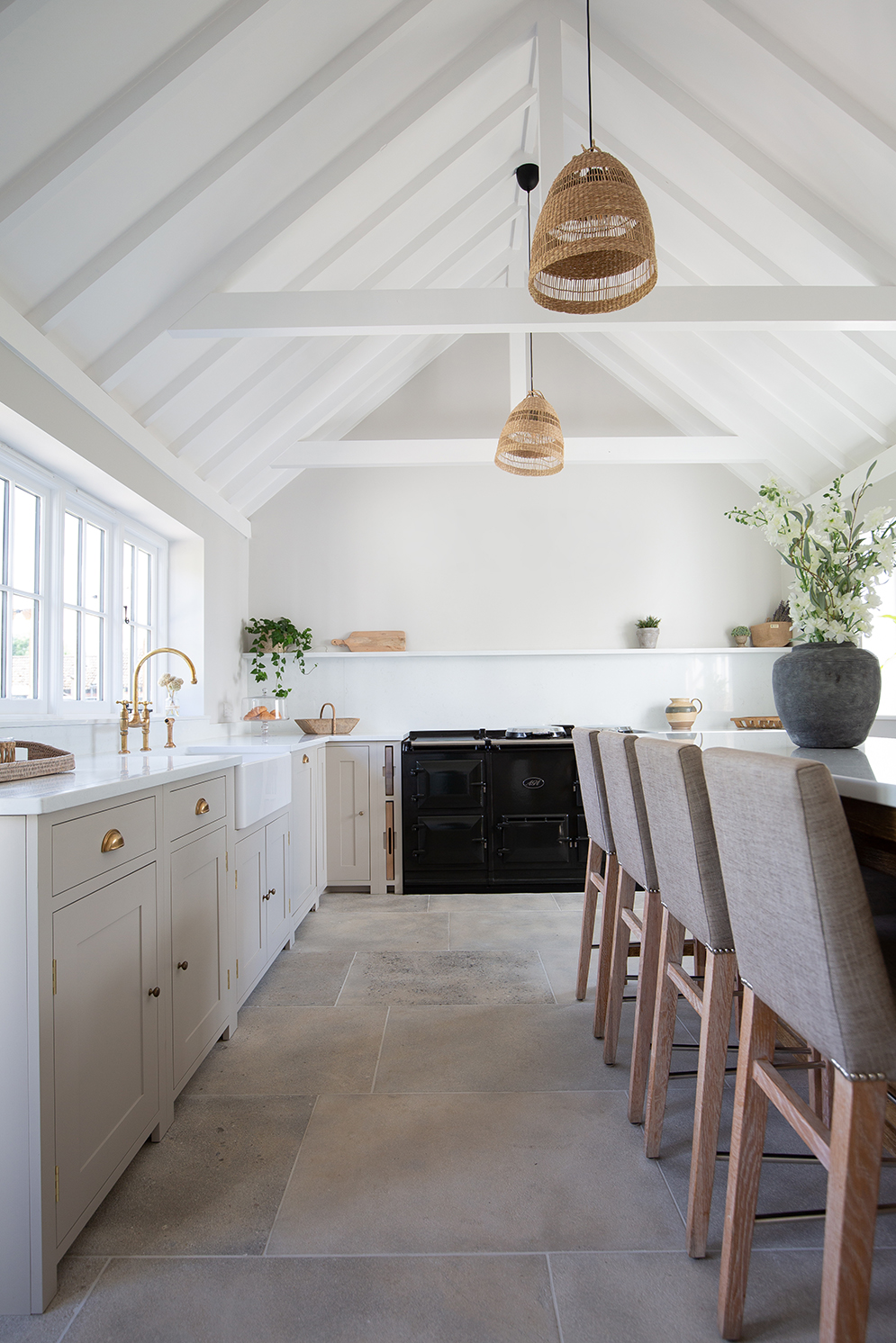 light and airy farmhouse style kitchen with grey natural limestone flooring
