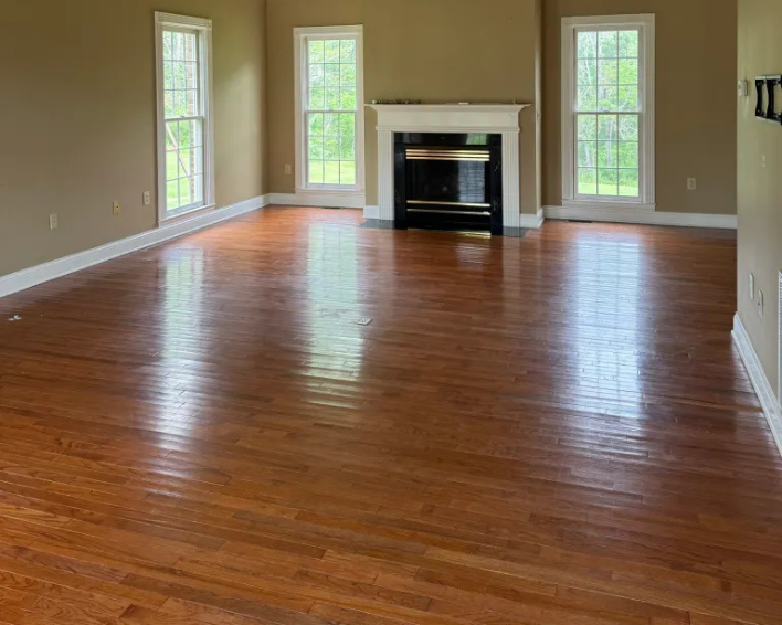 New hardwood flooring with blue cabinets in a remodeled kitchen